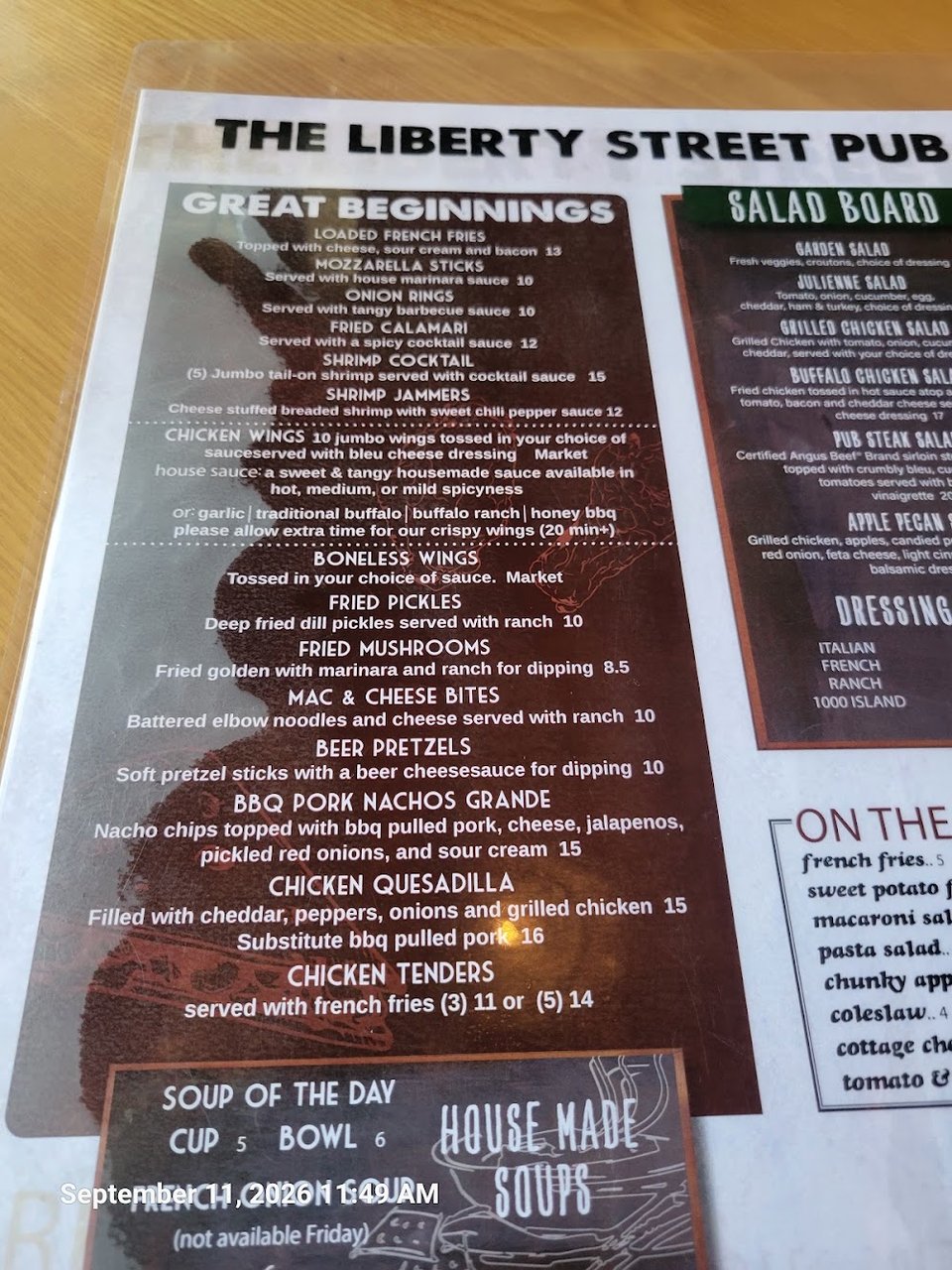 Pub menu page showing sandwiches and salad options.