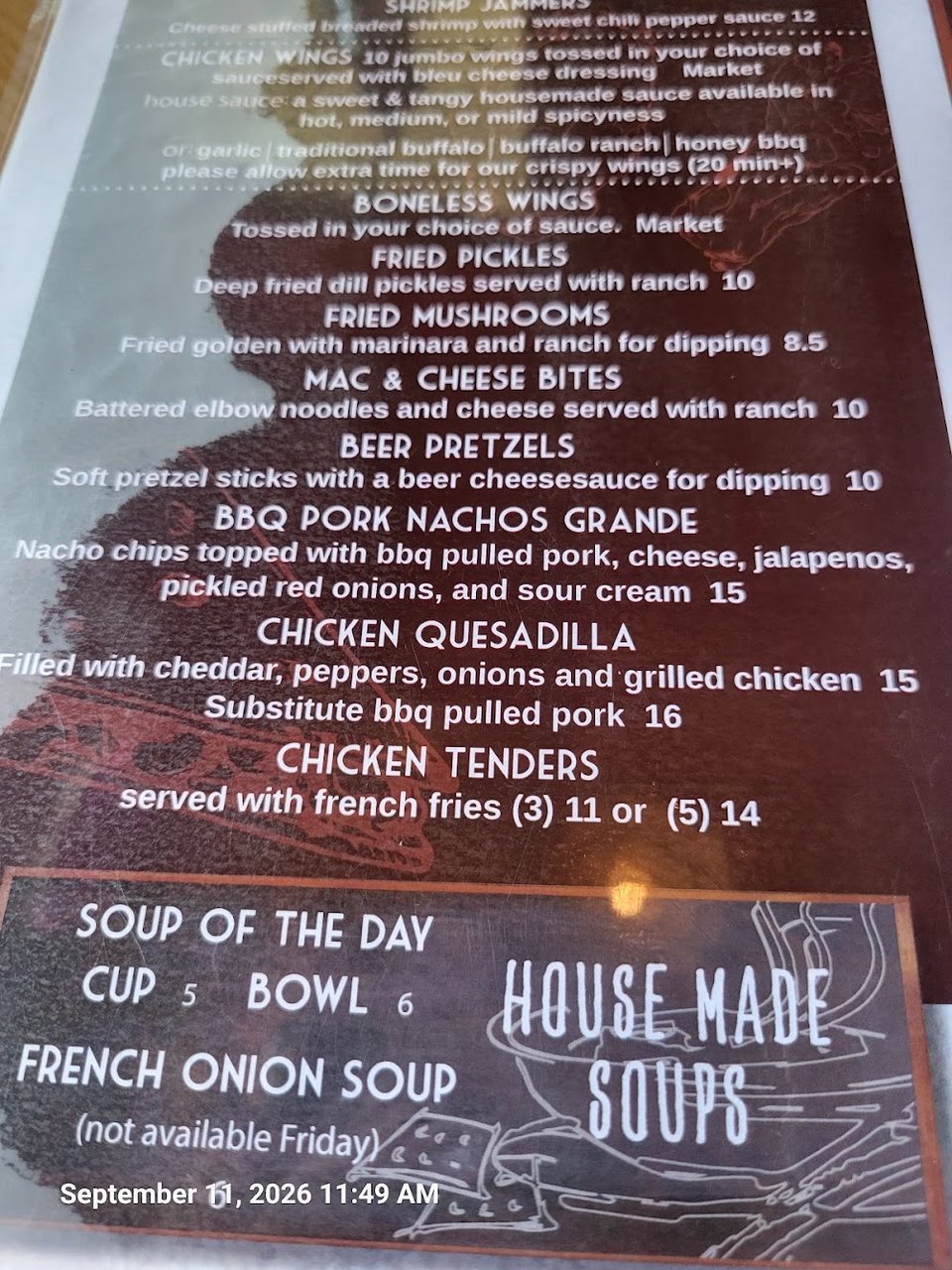 Menu board listing hot and cold pub fare.